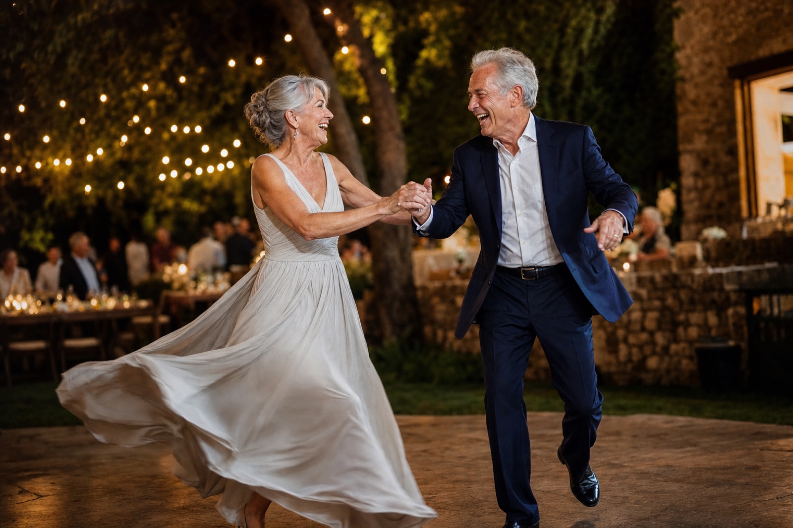 A couple dancing together at an outdoor evening wedding